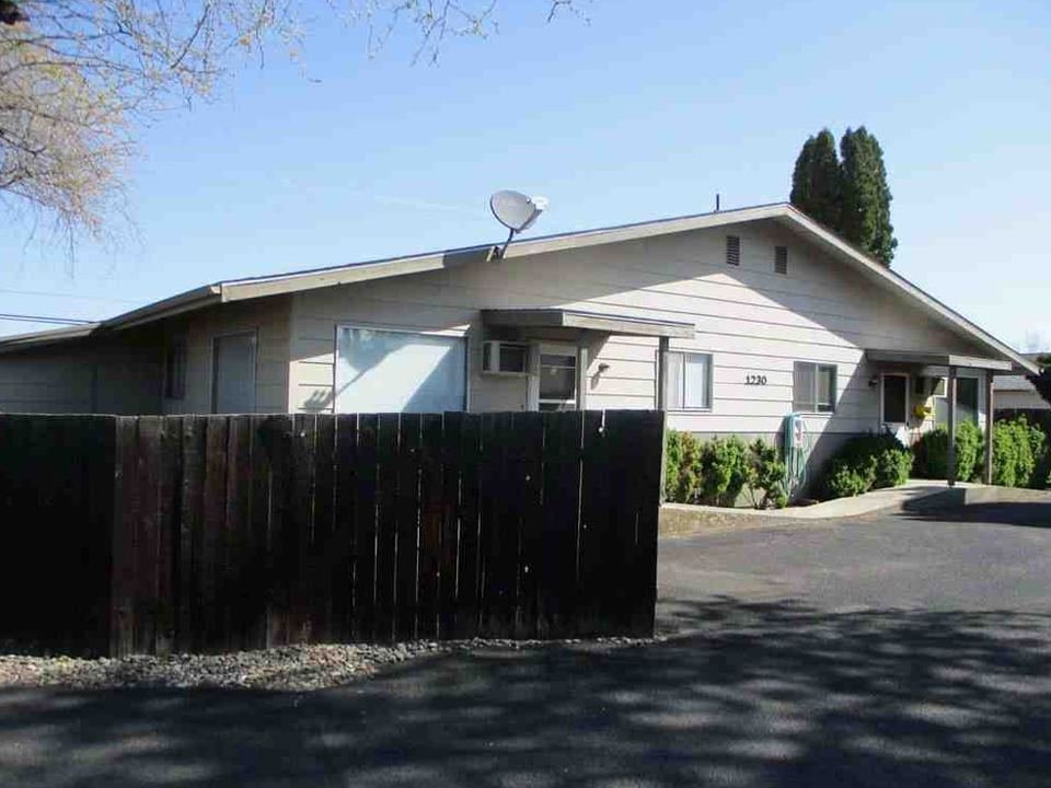 1230 Burrell behind a wood privacy fence