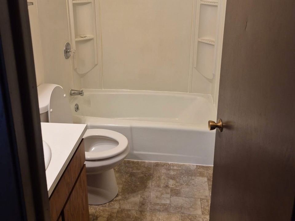 Bathroom with a tub and shower