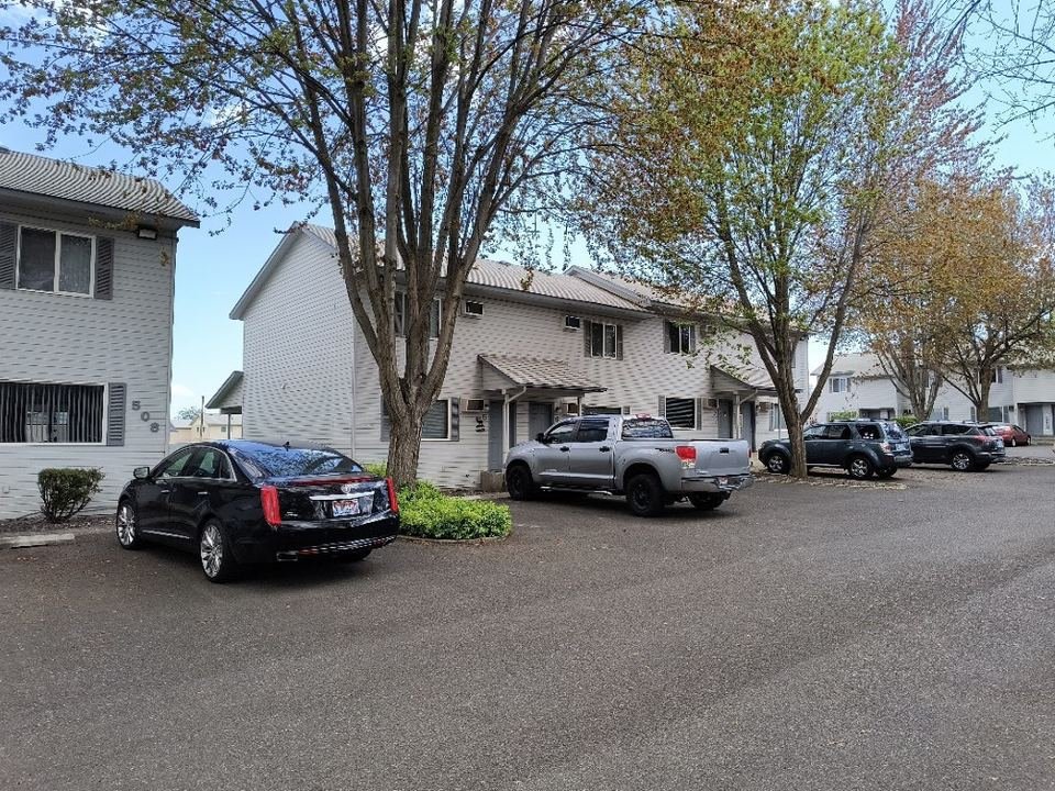 Side of the 508 Warner buildings with parking