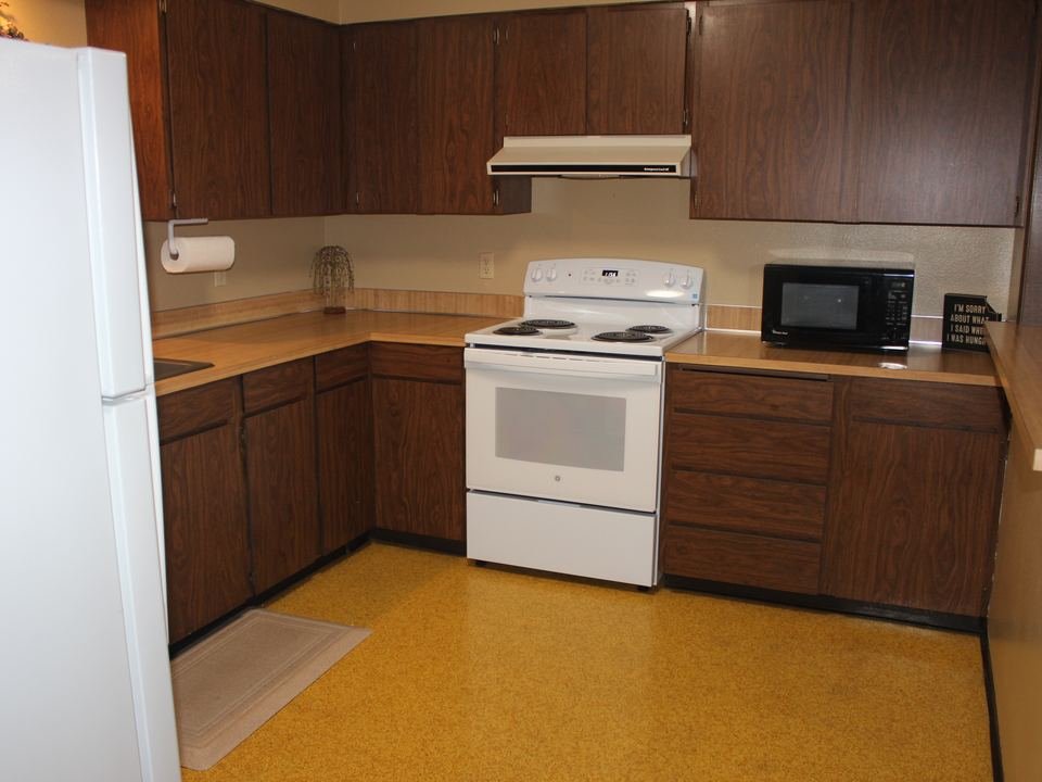 Clubhouse kitchen with a range, refrigerator and microwave