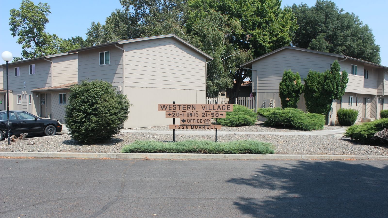 Western Village sign and apartment buildings at 1226 Burrell Avenue