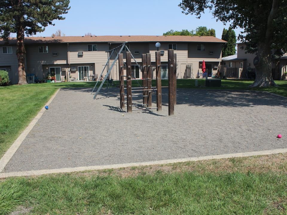 Playground with swings and a climbing frame